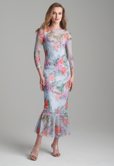 Woman wearing mesh floral dress topper over matching short stretch knit dress by Ala von Auersperg for summer 2024