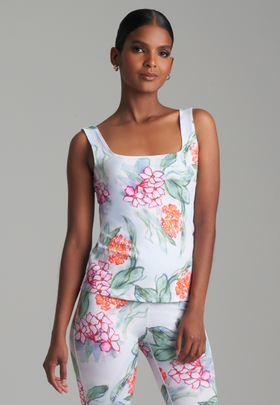 Woman wearing tropical floral printed stretch knit tank top by Ala von Auersperg