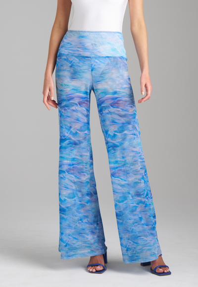Woman wearing mesh ocean wave blue printed pants by Ala von Auersperg for summer 2023