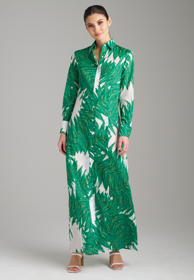 Woman wearing green palm printed long t shirt cotton dress with buttons down the front and collar detail by Ala von Auersperg
