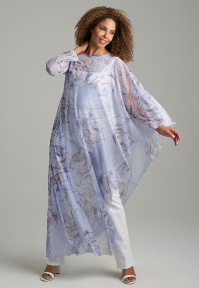 Woman wearing blue rose printed sheer mesh one sleeved poncho kaftan over italian stretch cotton square neck tank top and pant by Ala von Auersperg for spring summer 2022