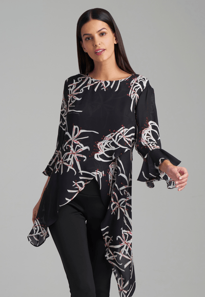 Woman wearing assymetrical black spider lily silk blouse by Ala von Auersperg for holiday 2021