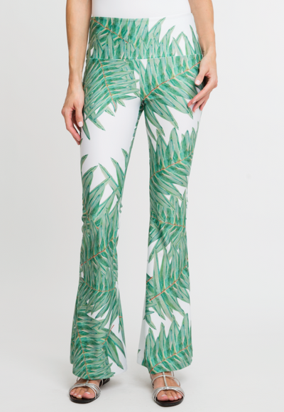 Woman wearing green stretch knit palm leaf printed pants by Ala von Auersperg 