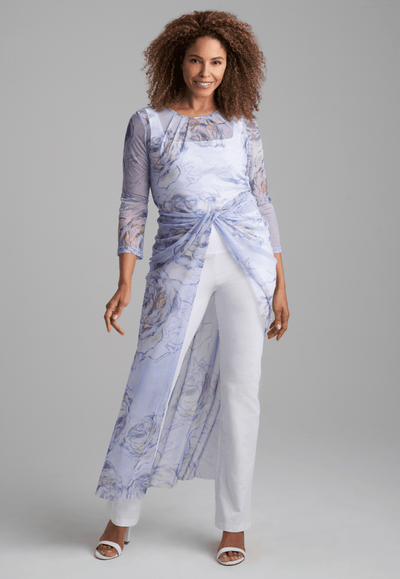 Woman wearing mesh asymmetrical  blue rose printed topper over italian stretch cotton square neck tank top and pants by Ala von Auersperg for spring summer 2022