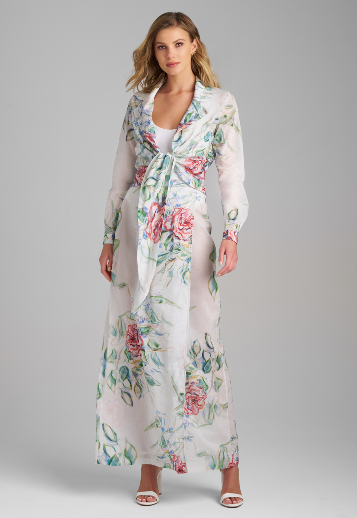 Woman wearing rose printed cotton wrap top with wrap cotton skirt by Ala von Auersperg for summer 2023