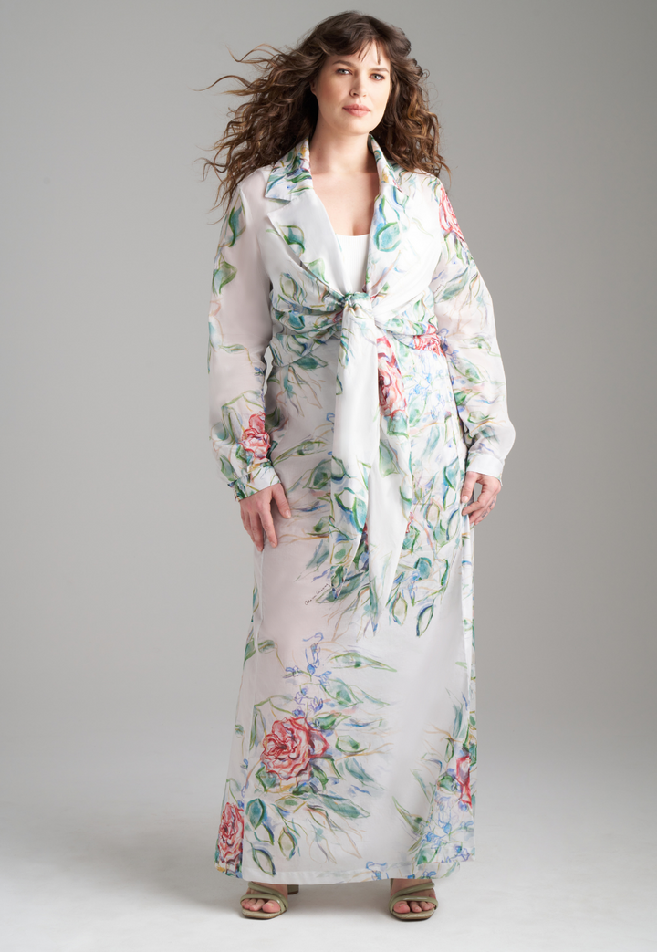 Woman wearing rose printed cotton wrap top with wrap cotton skirt by Ala von Auersperg for summer 2023