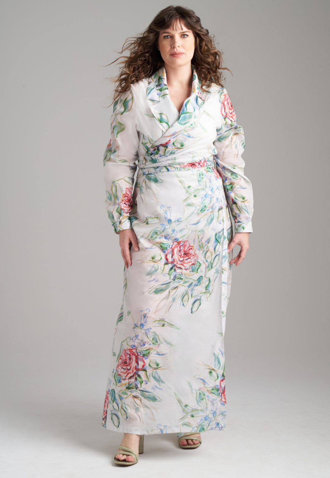 Woman wearing rose printed cotton wrap top with wrap cotton skirt by Ala von Auersperg for summer 2023