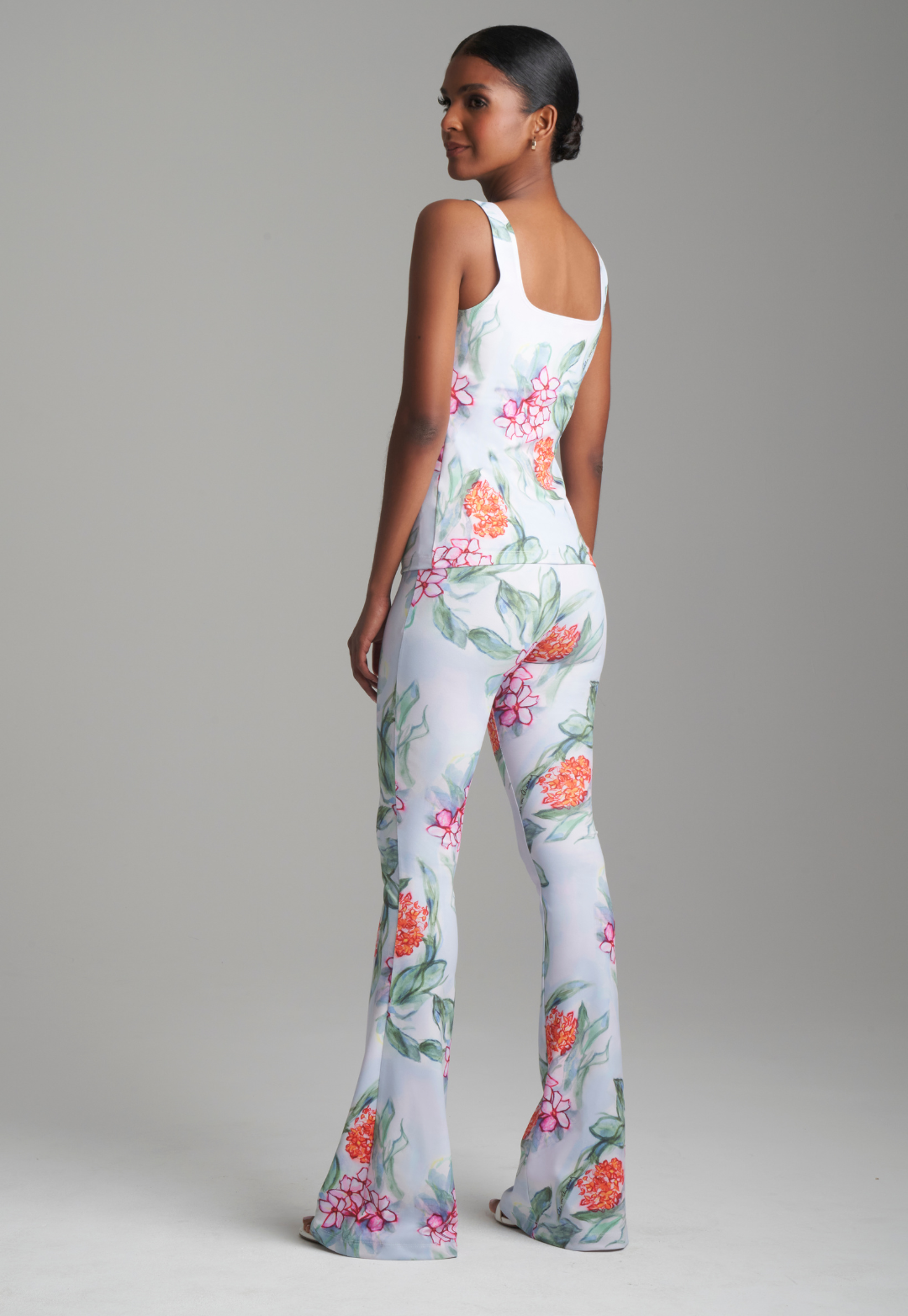 Woman wearing scoop neck printed stretch knit tank top with matching pants by Ala von Auersperg 