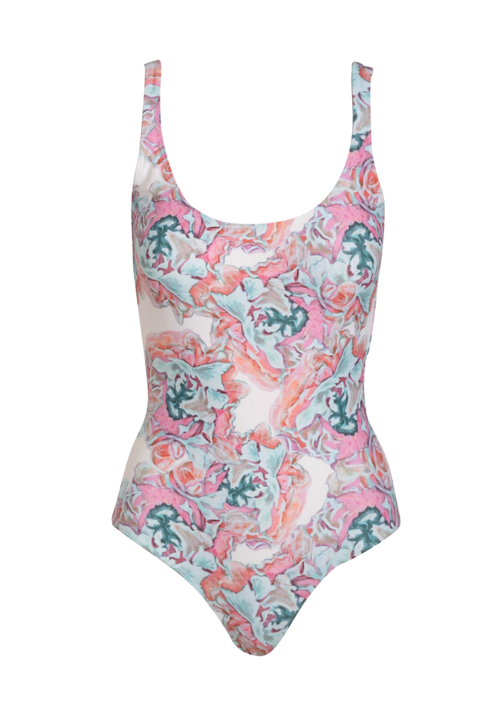 Pink and white floral printed swimsuit by designer Ala von Auersperg for women's luxury resort travel fashion