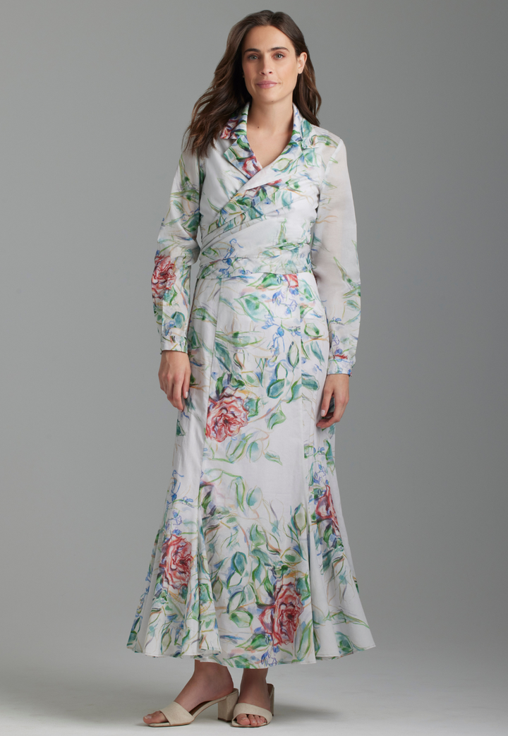 Woman wearing cotton wrap top and skirt in rose print by Ala von Auersperg for summer 2023