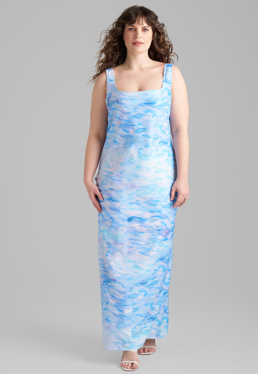 Woman wearing stretch knit ocean wave printed long dress by Ala von Auersperg for summer 2023