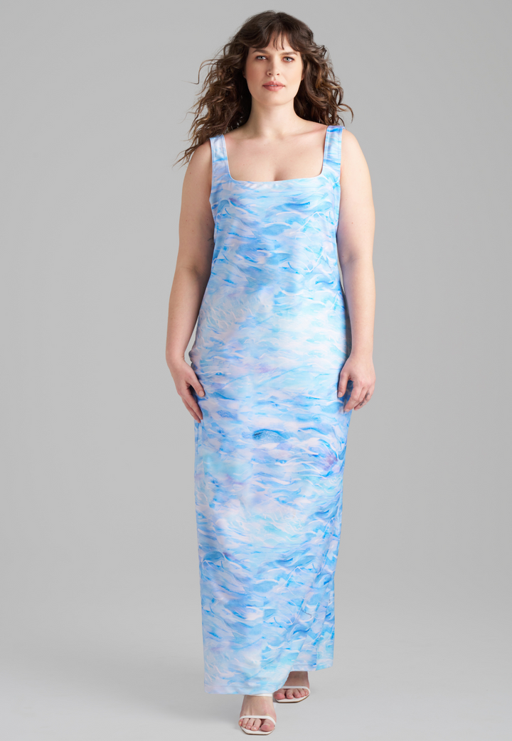 Woman wearing stretch knit ocean wave printed long dress by Ala von Auersperg for summer 2023