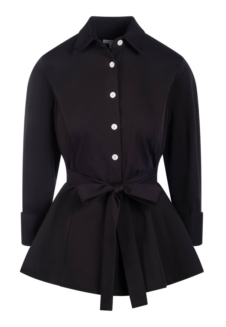 Black shirt with a tie waist on a white background by designer Ala von Auersperg for womens luxury travel clothing