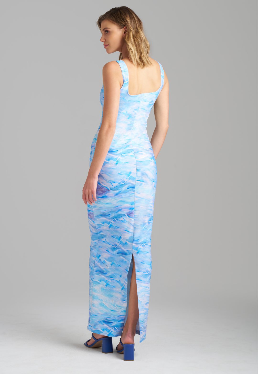 Woman wearing stretch knit ocean wave printed long dress by Ala von Auersperg for summer 2023