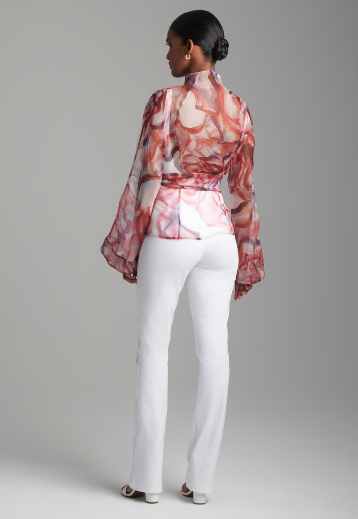 Woman wearing red rose printed silk organza kimono blouse with high neckline and belt over italian stretch cotton white tank top and pants by Ala von Auersperg