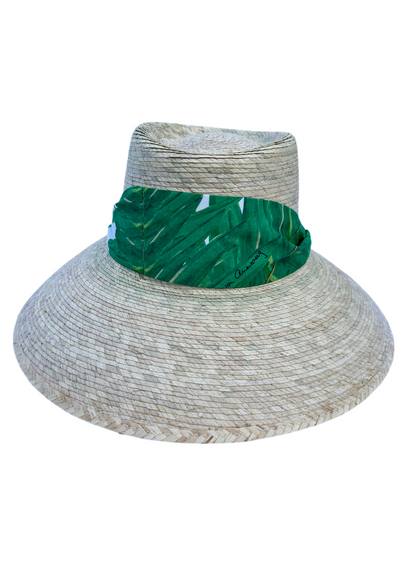 Straw sun hat with a large brim and green palm leaf printed cotton ribbon by Ala von Auersperg and Sarah Bray Bermuda