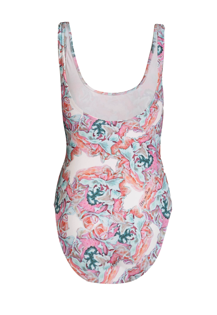 One piece bathing suit in a pink and green floral print by designer Ala von Auersperg for women's luxury resort travel fashion