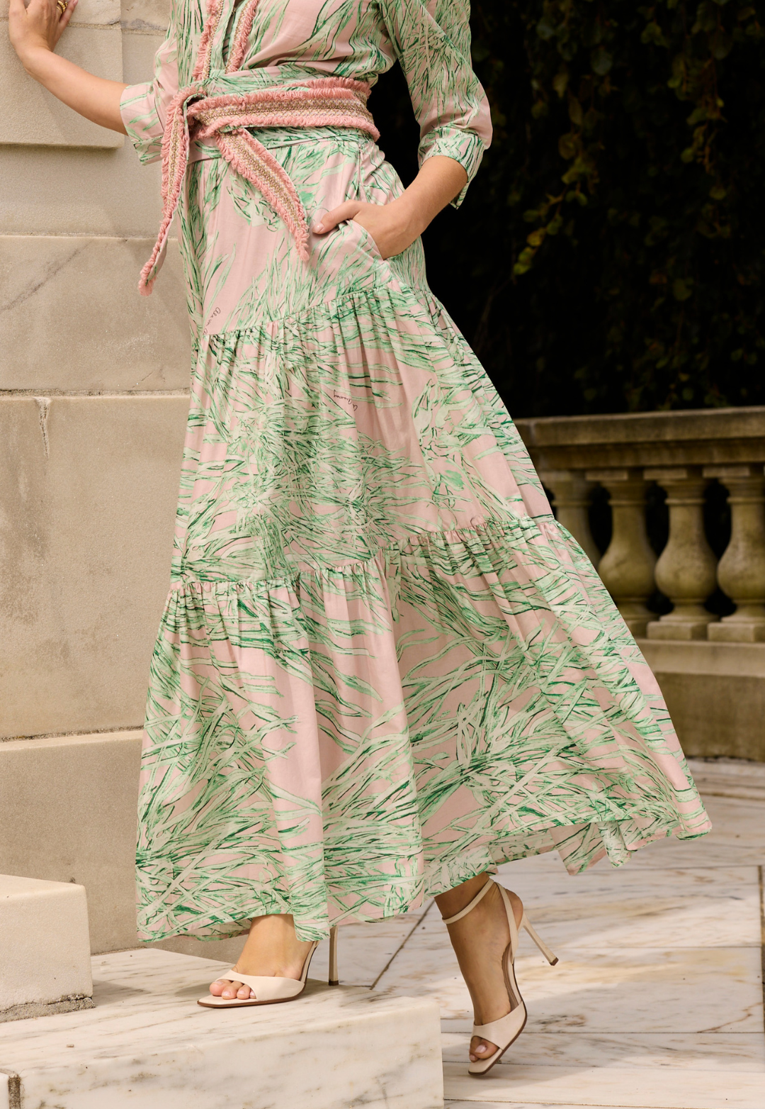 Woman wearing green and pink printed cotton skirt 