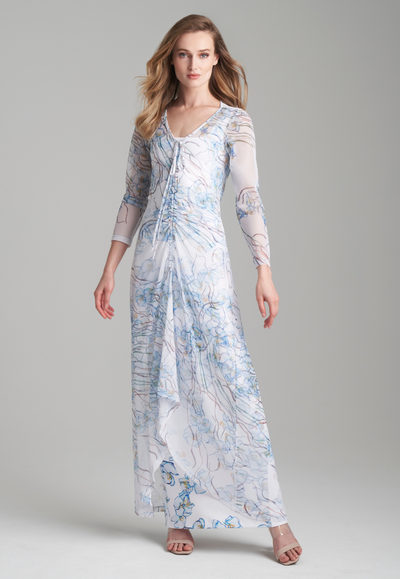 Woman wearing mesh drawstring sheer dress over long stretch knit white dress with blue orchids by Ala von Auersperg for spring 2024