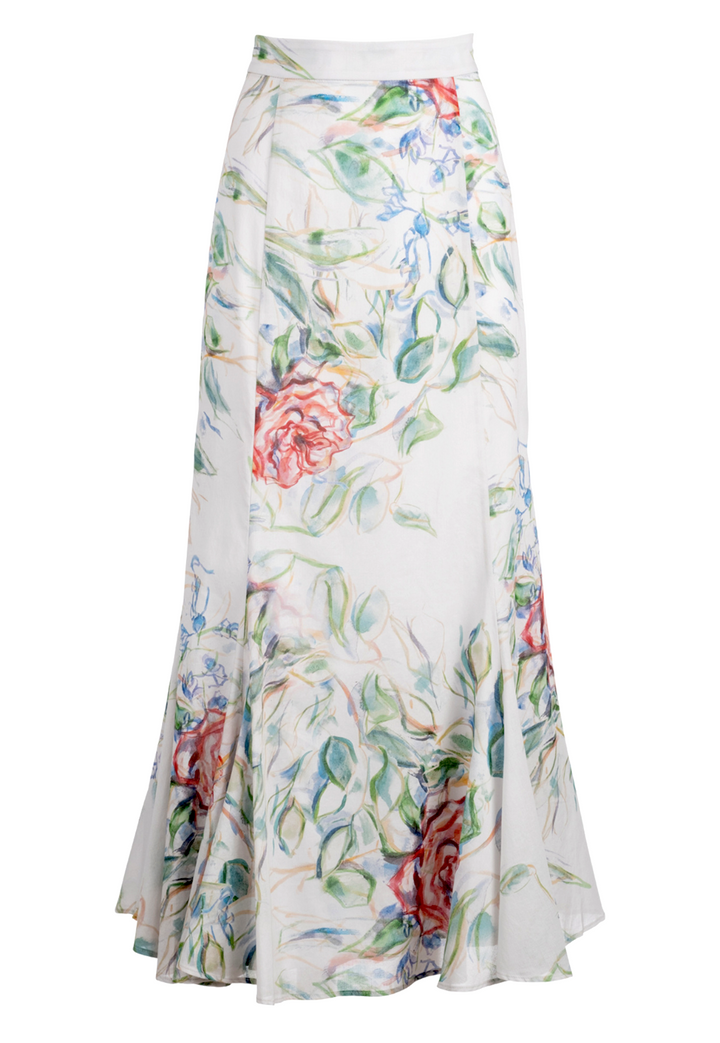 Woman wearing cotton wrap top and skirt in rose print by Ala von Auersperg for summer 2023