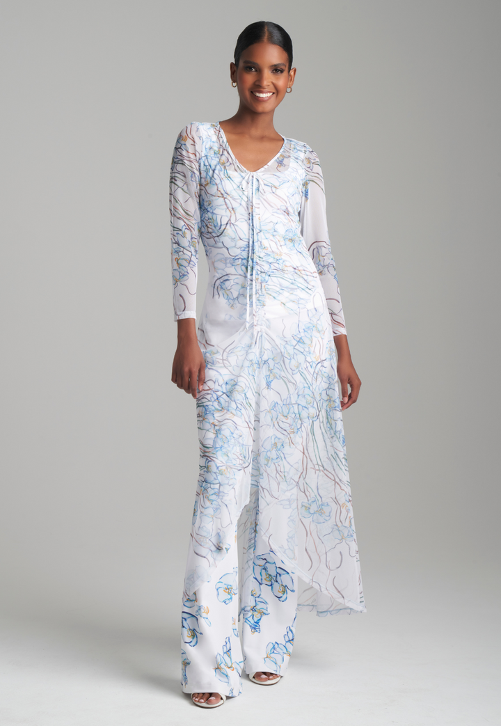 Woman wearing three piece mesh and stretch knit outfit set with a tank top pants and a mesh topper by Ala von Auersperg for spring 2024