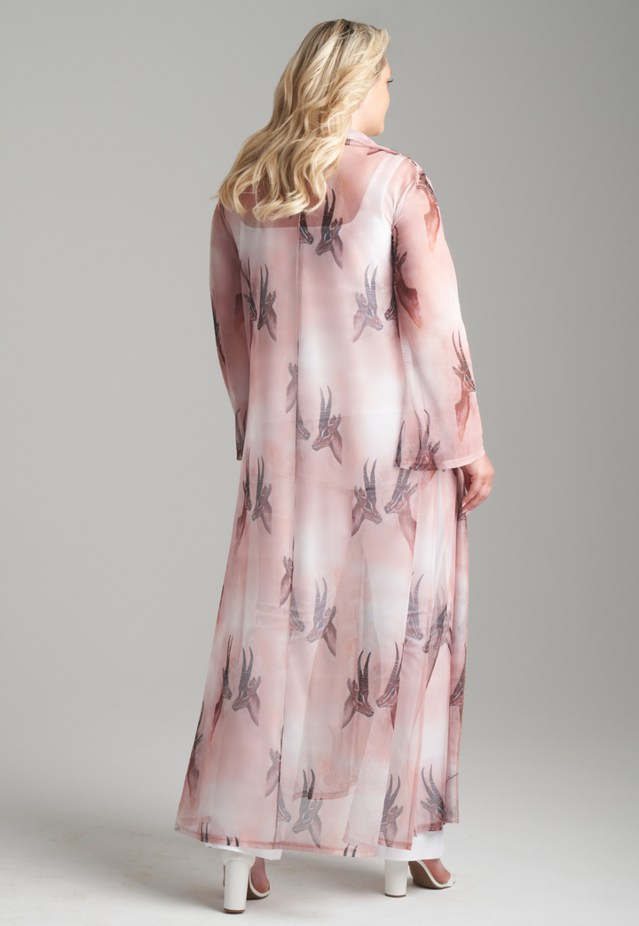 Woman wearing long mesh duster robe in brown deer print over white stretch knit tank top and pants by Ala von Auersperg for fall 2023