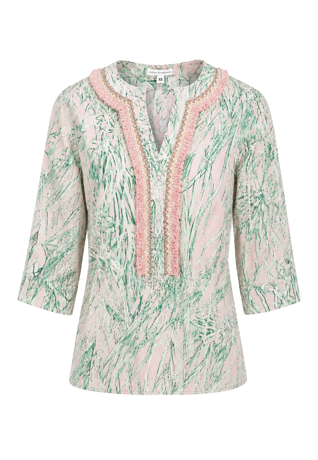 Light pink and green patterned top with lace trim on a white background