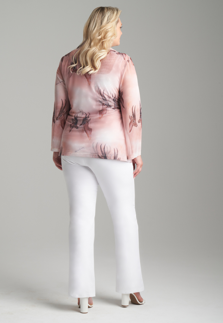 Woman wearing mesh v-neck sweater with organza collar in brown deer print paired with white stretch knit pants by Ala von Auersperg for fall 2023