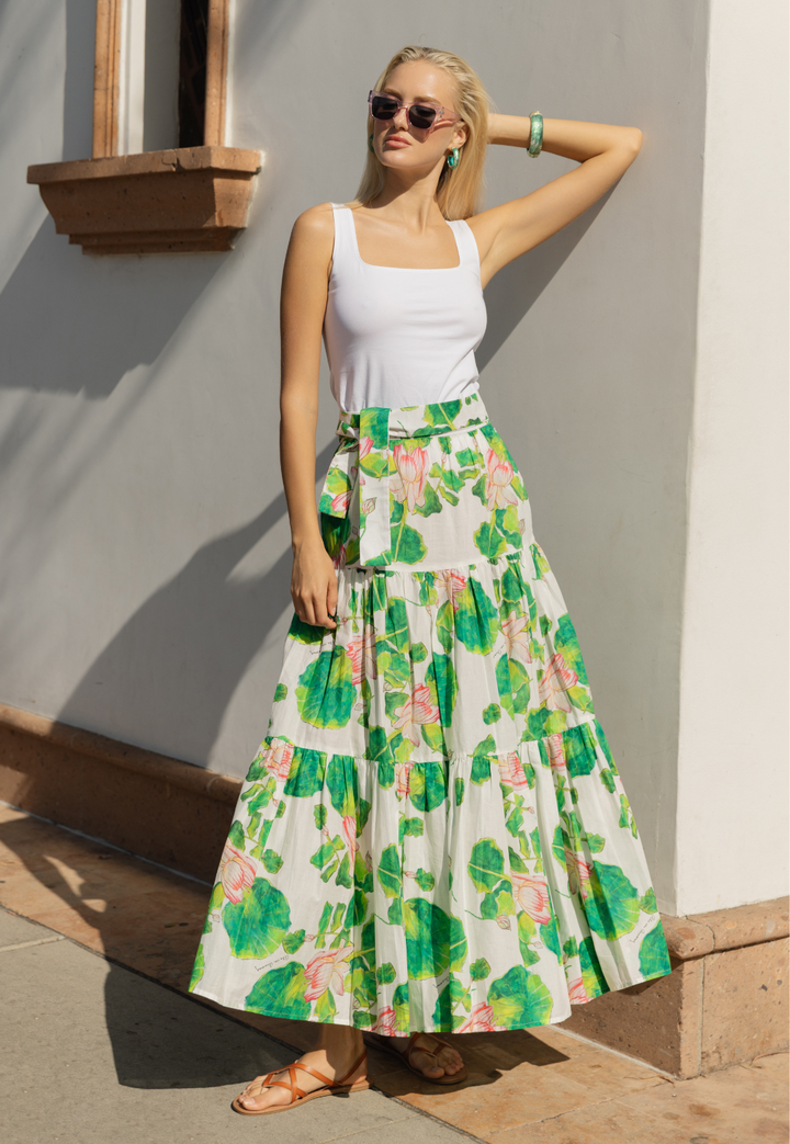 Woman wearing white tank top with floral peasant skirt