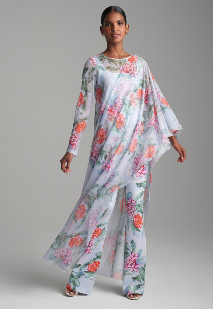 Woman in floral mesh kaftan topper over tank top and matching pants by Ala von Auersperg