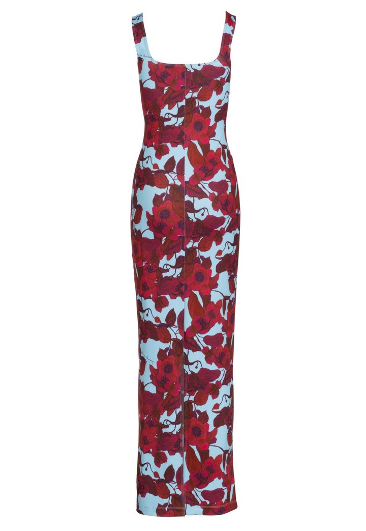Flat image of a long stretch knit square neck dress in a red floral print with a blue background by designer Ala von Auersperg for womens luxury travel clothing