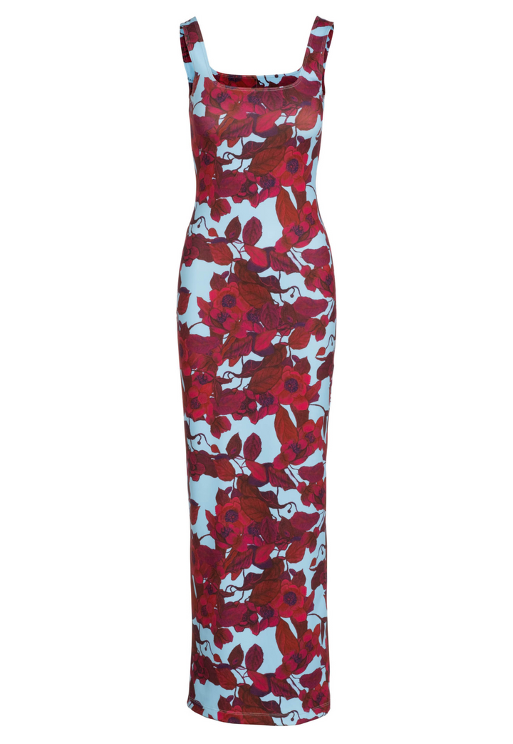 Flat image of a square neck long stretch knit dress in a red floral print with a blue background by designer Ala von Auersperg for womens luxury travel clothing