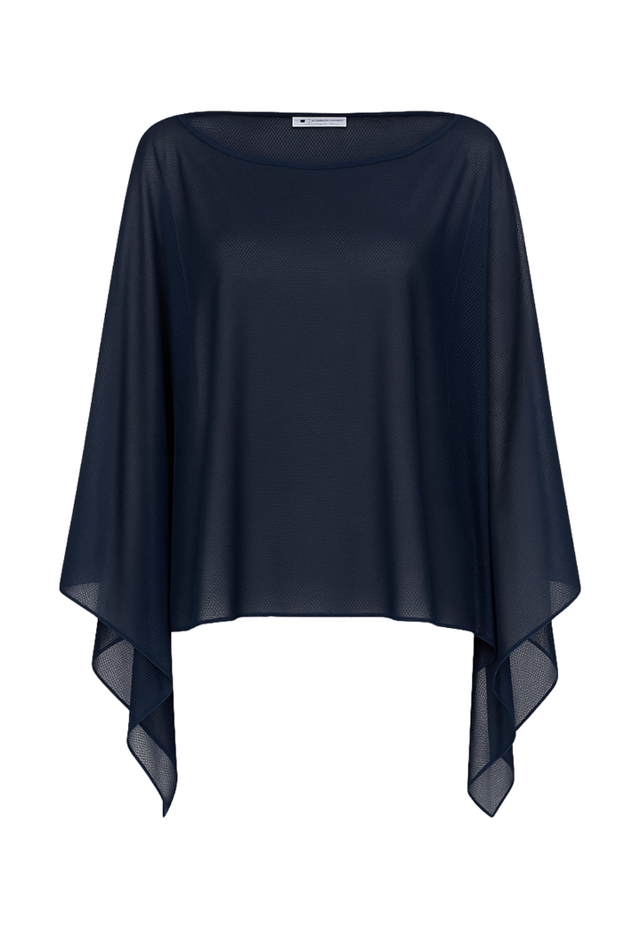 Flat image of a sheer mesh poncho by designer Ala von Auersperg for womens luxury travel clothing