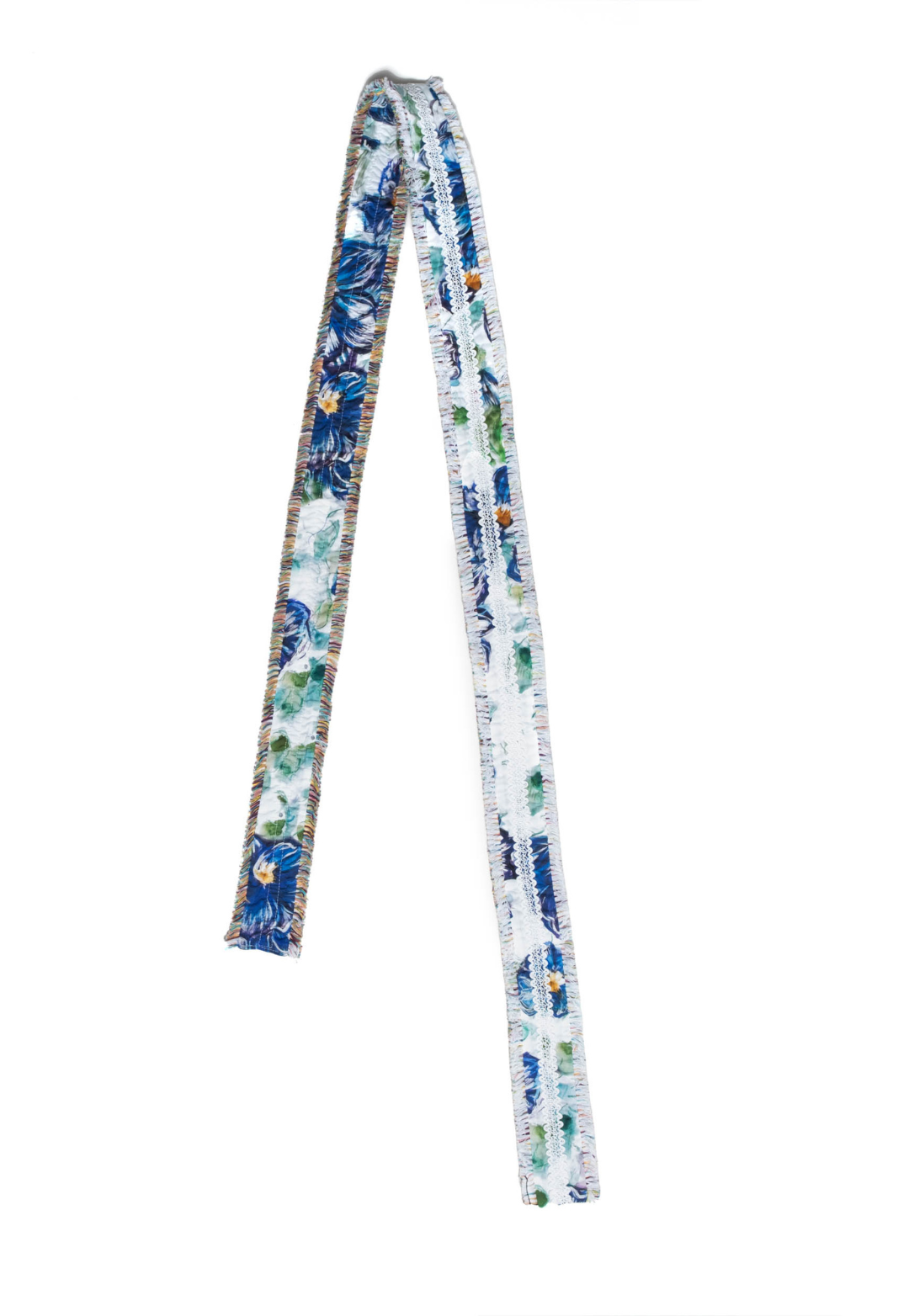 Flat image of a cotton belt in a blue floral print by designer Ala von Auersperg for womens luxury travel clothing