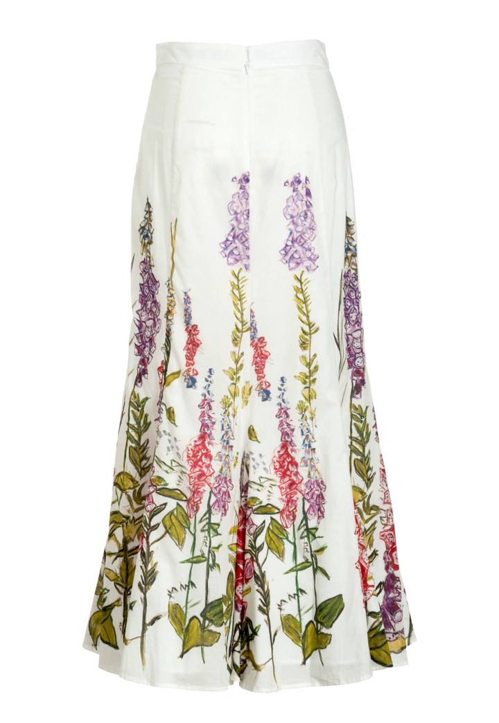 Flat image of the back of a cotton white floral printed skirt by designer Ala von Auersperg for womens luxury travel clothing