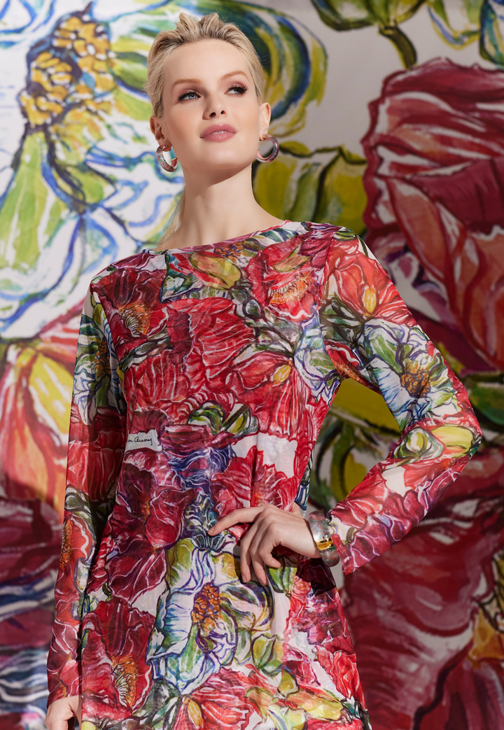 Woman wearing sheer mesh top over a stetch knit tank top in a matching print by designer Ala von Auersperg for womens luxury travel clothing