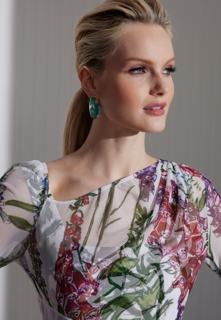 Woman wearing sheer mesh dress topper over matching long stretch knit dress by designer Ala von Auersperg for womens luxury travel clothing