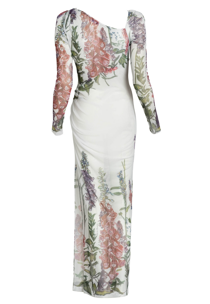 Flat image of the back of an asymmetrical sheer mesh dress topper in a white floral print by designer Ala von Auersperg for womens luxury travel clothing
