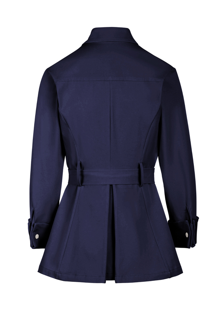 Navy blue trench coat on a white background by designer Ala von Auersperg for womens luxury travel clothing