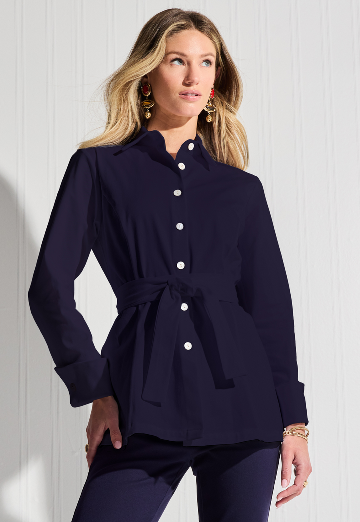 Woman wearing cotton navy blouse by designer Ala von Auersperg for womens luxury travel clothing