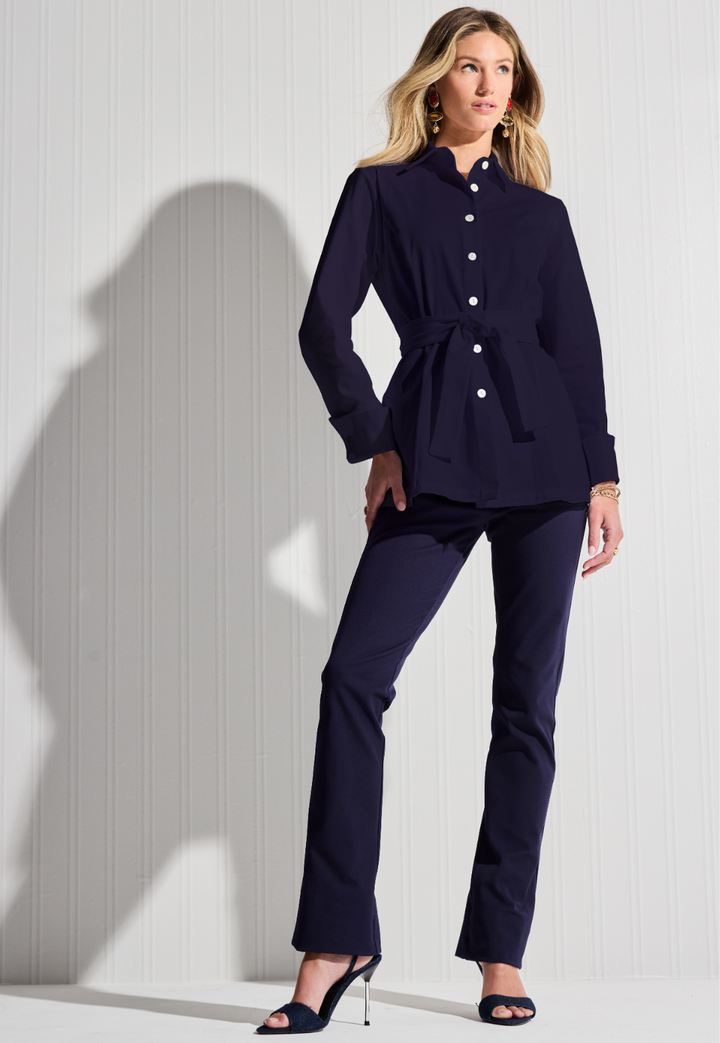 Woman wearing navy blue cotton blouse and pants by designer Ala von Auersperg for womens luxury travel clothing