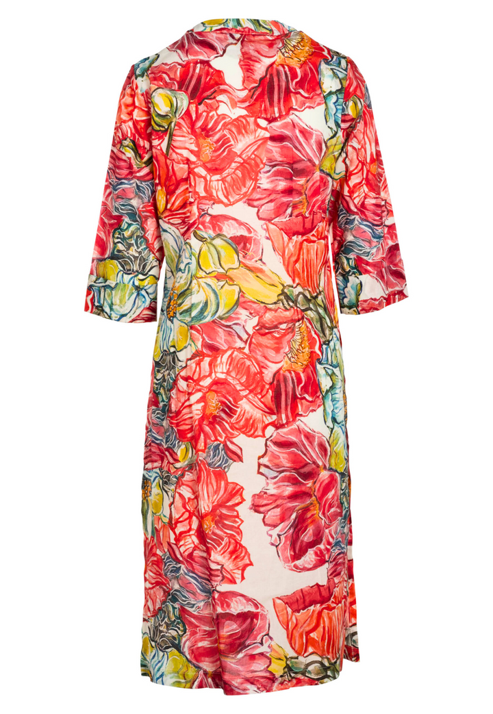 Image of a long cotton tunic in a red floral print by designer Ala von Auersperg for womens luxury travel clothing