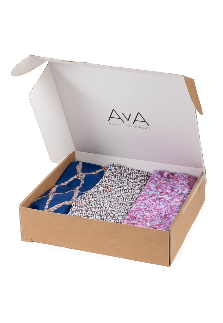 Box of three tank top in surprise prints by designer Ala von Auersperg for womens luxury travel clothing