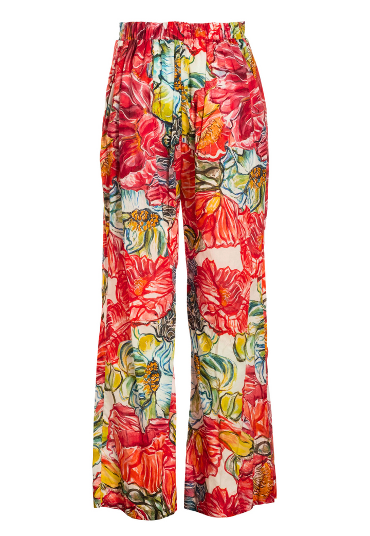 Image of a straight leg cotton pant in a red floral print by designer Ala von Auersperg for womens luxury travl clothing