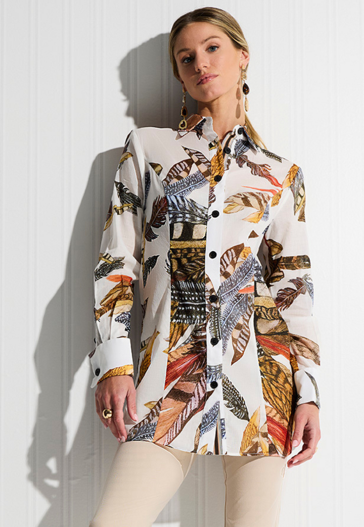 Woman wearing Annie White Fantasia feather print cotton blouse with khaki stretch knit pants