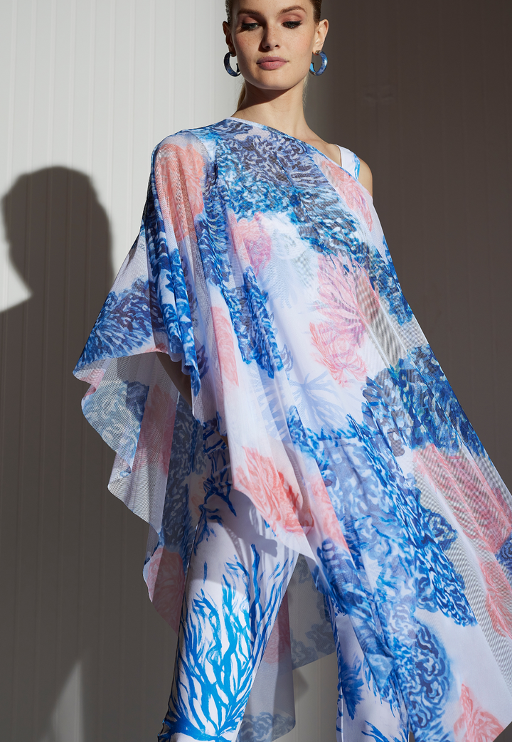 Artemisia Coral Reef sheer mesh poncho styled with matching printed pants and coral earrings
