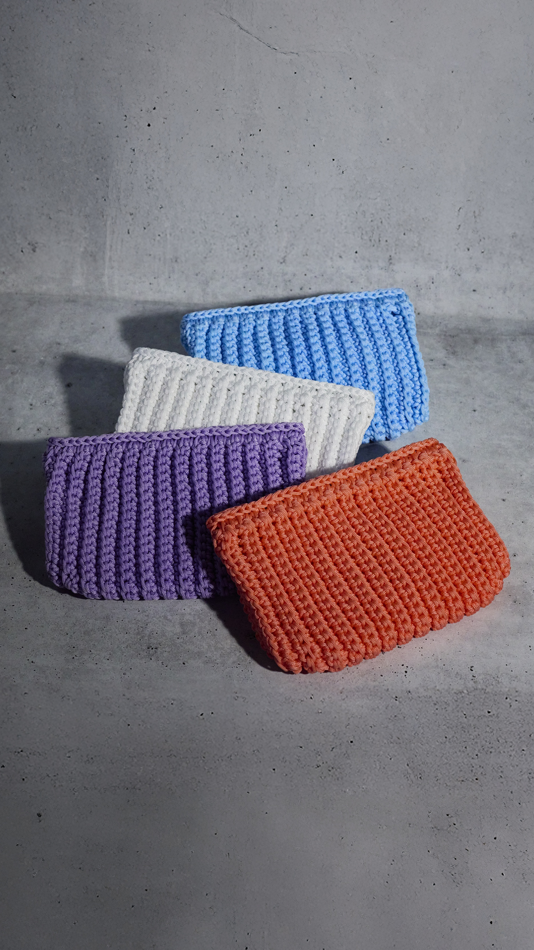 Coral crochet clutch bag by Ala von Auersperg