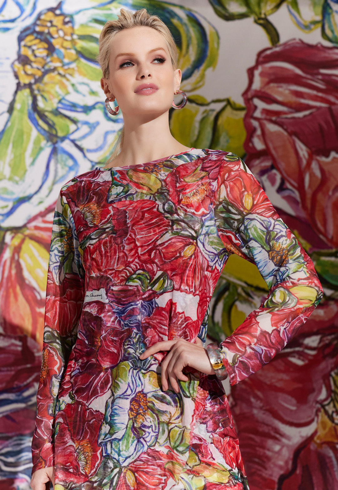 Woman wearing Diane red floral sheer mesh top