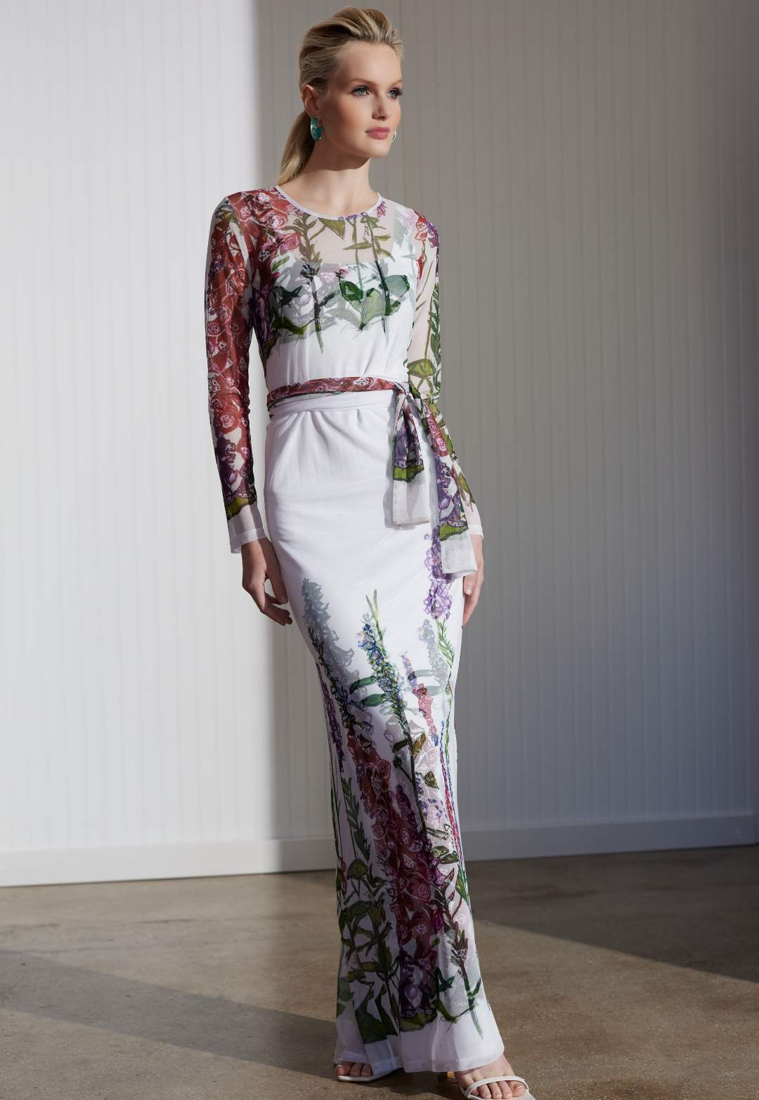 Woman wearing Foxgloves sheer wrap dress over matching dress