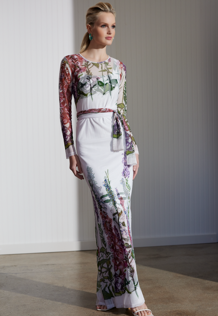 Woman wearing Foxgloves sheer wrap dress over matching dress